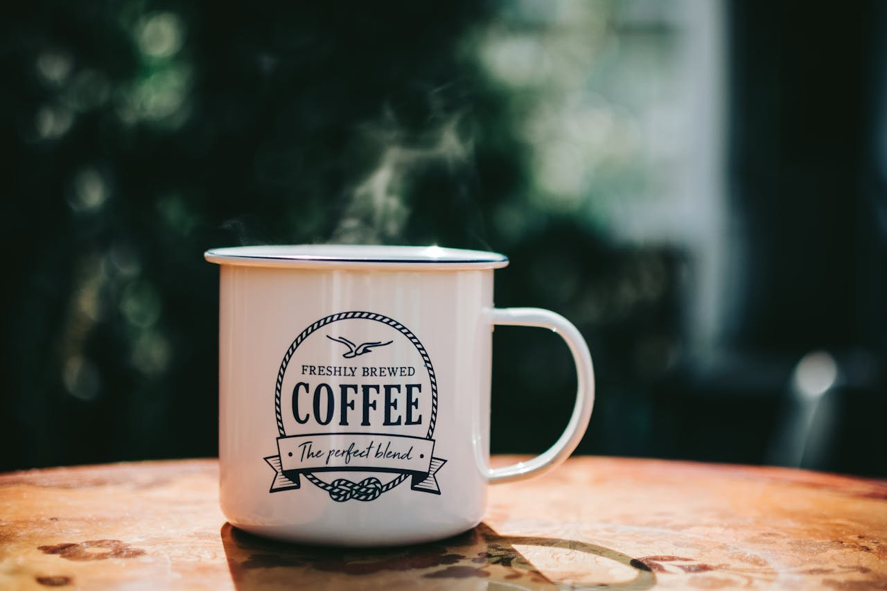 Mastering the First Impression: Your intriguing post title goes here Warm coffee mug steaming on a rustic table, evoking cozy morning vibes.